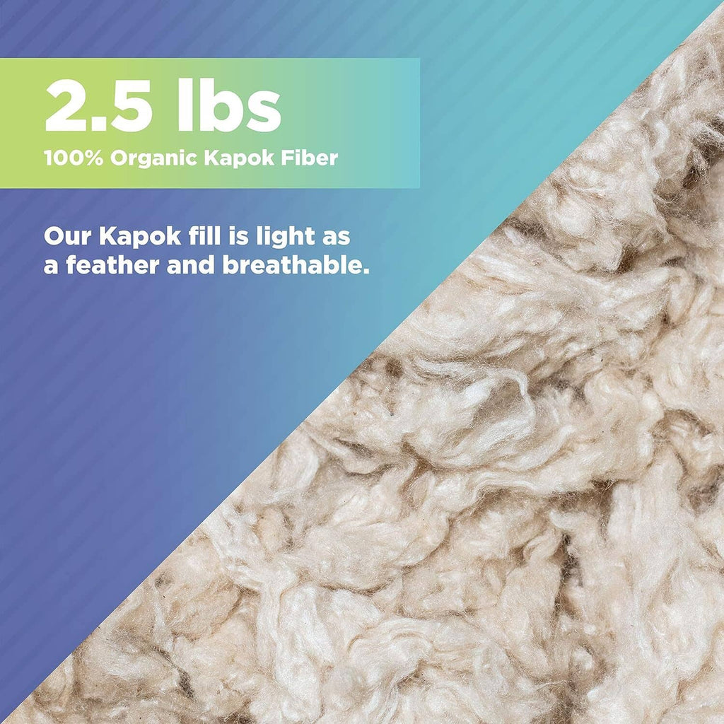 Close-up of organic kapok fiber fill, creamy white fluffy strands.