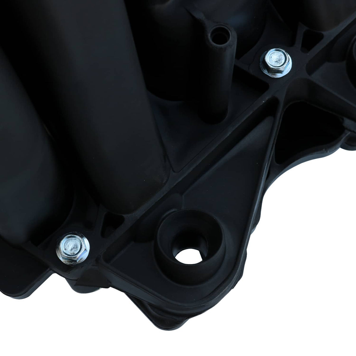 Black intake manifold underside with metal bolts and circular opening