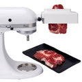 Meat tenderizer attachment with rotating drum, mounted on a stand mixer