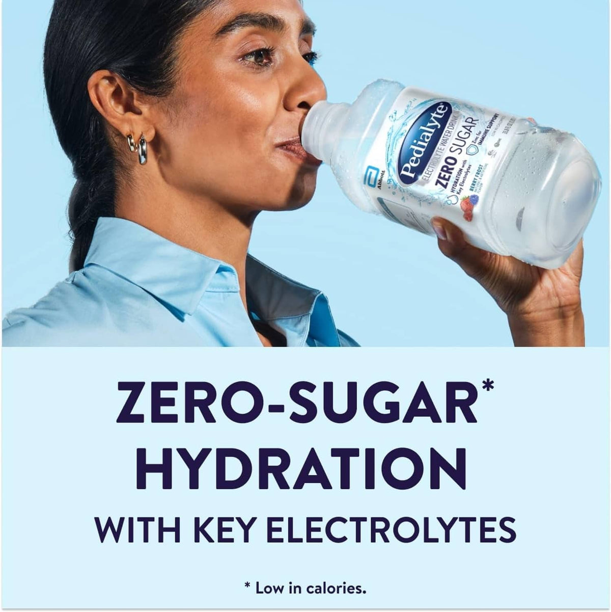 Pedialyte Zero Sugar electrolyte water bottle being sipped, Berry Frost flavor
