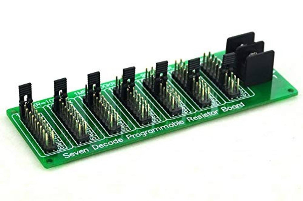 Green programmable resistor board at angle with rows of black resistor IC modules