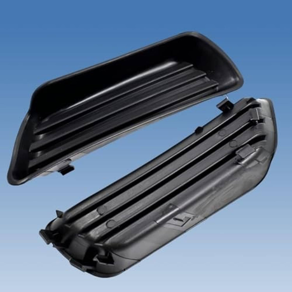 Black fog light cover housing with horizontal slat grille and attachment clips