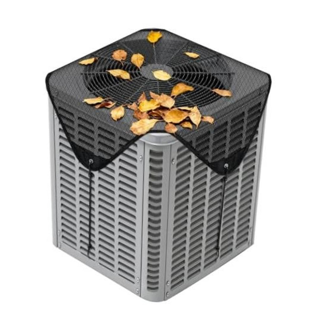 Black mesh central air conditioner cover with V-shaped opening and debris on top