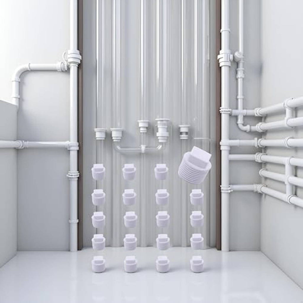 White PVC male threaded pipe end caps, 1/2 inch, caps arranged in a plumbing bay