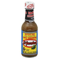 El Yucateco habanero hot sauce bottle, brown glass with white cap and blue label