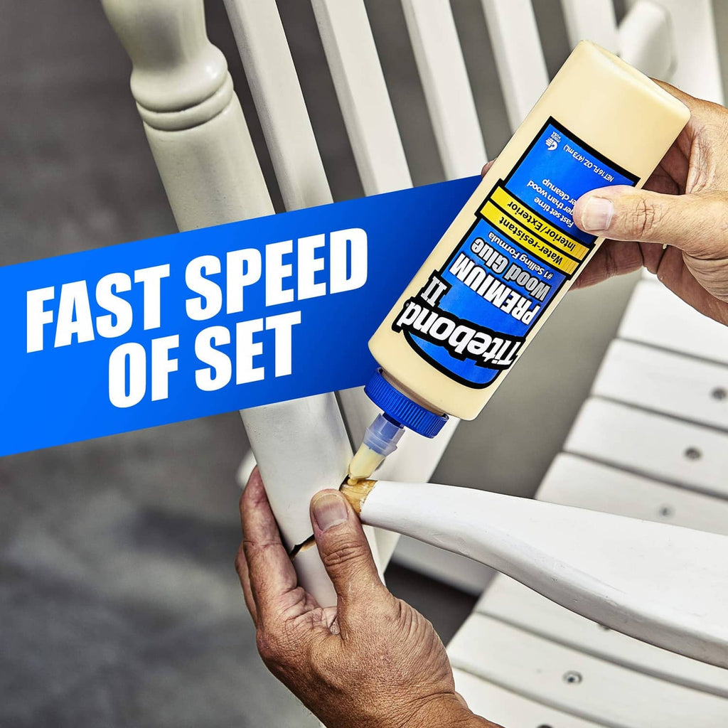 Hand applying Titebond II premium wood glue from a squeeze bottle onto wood