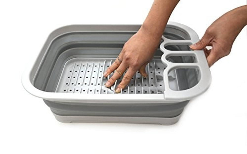 Gray dish drainer tray with perforated rack and utensil holder, hand adjusting