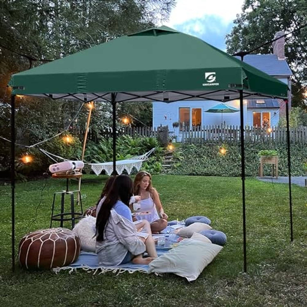 Green pop up canopy top cover outdoors with center air vent opening