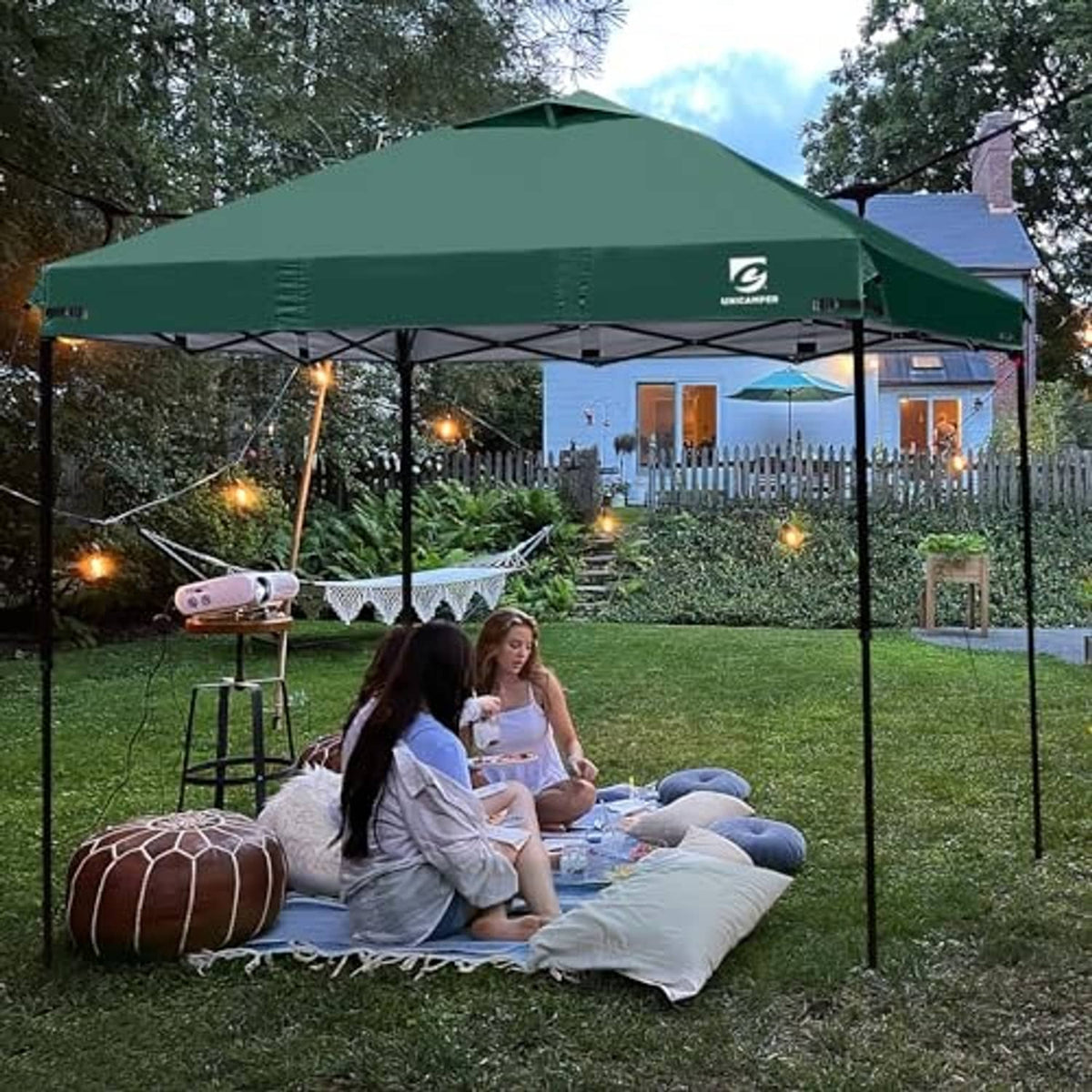 Green pop up canopy top cover outdoors with center air vent opening