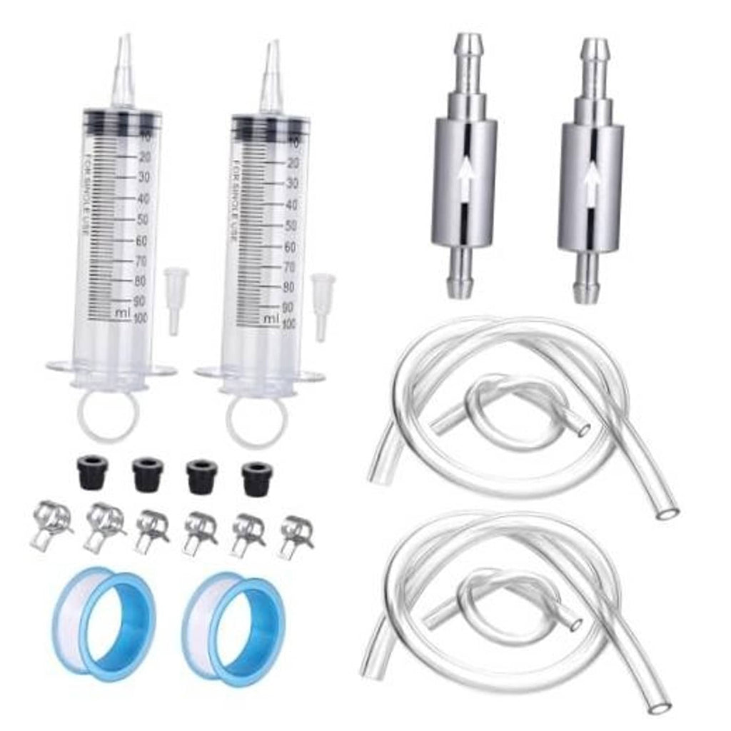 Brake bleeder kit components: 2 measured syringes, clear hoses, clamps, and rubber caps.