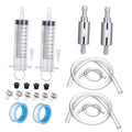 Brake bleeder kit components: 2 measured syringes, clear hoses, clamps, and rubber caps.
