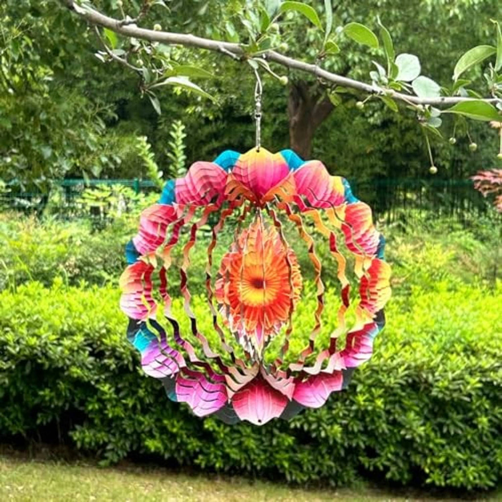 Colorful metal mandala wind spinner with layered petals, hanging from a tree branch