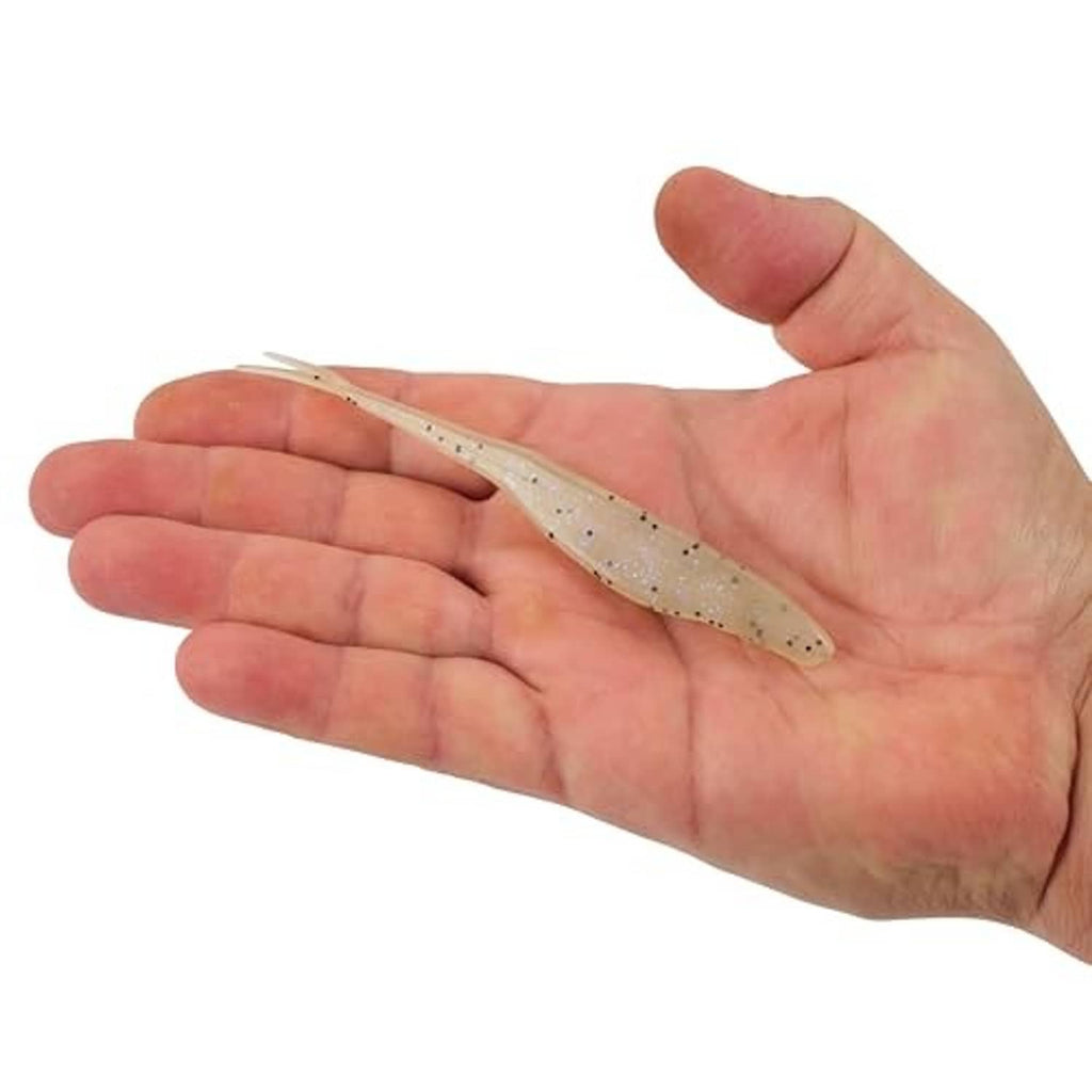 Soft plastic jerk bait in hand, beige with dark speckles