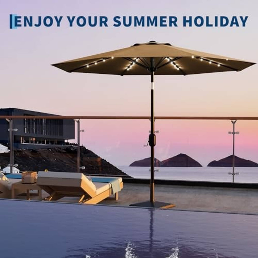 Tan patio umbrella with solar LED lights over outdoor seating by a poolside area