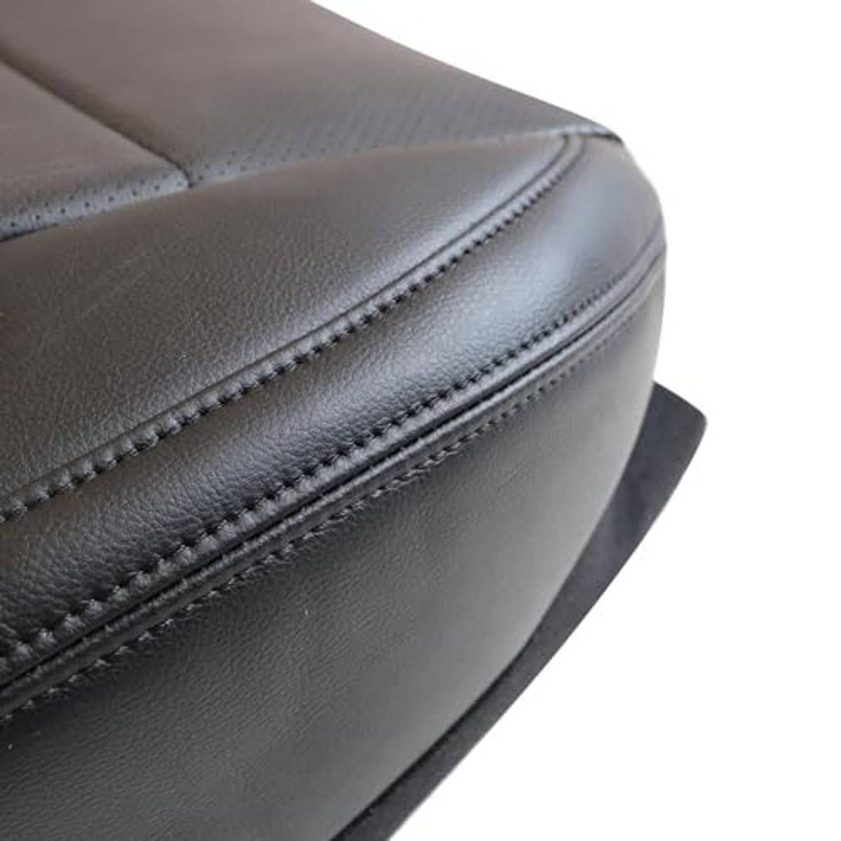 Close-up of black stitched seam on perforated microfiber leather seat cover padding.