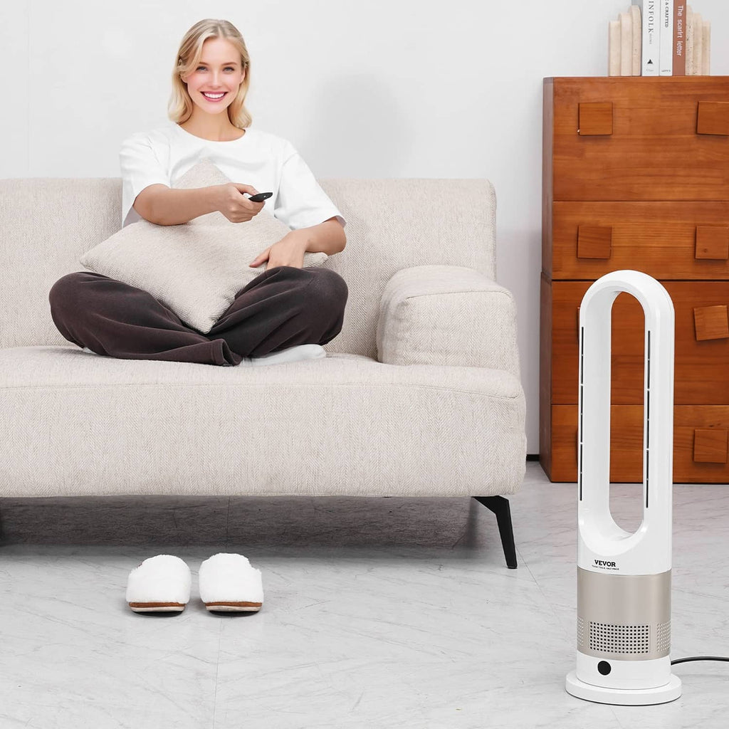 White bladeless tower fan heater next to couch, with oval air outlet