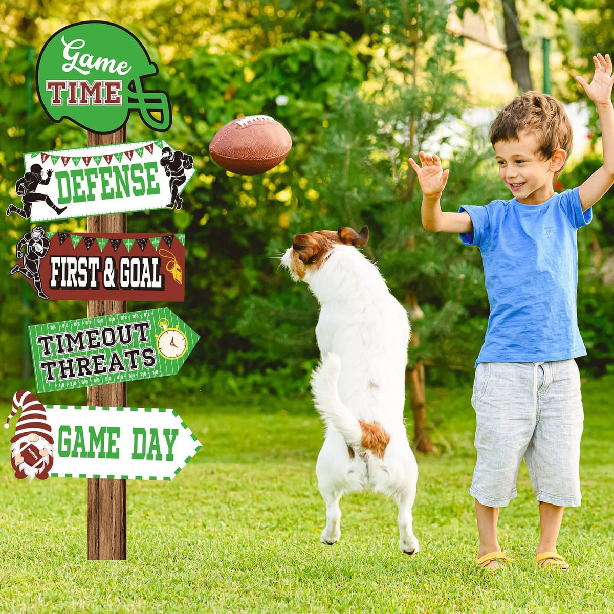 Soccer yard signs on stakes, featuring green “Game Time” and black “Defense” designs