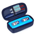 Navy insulin travel cooler case with blue insert, opened, holding insulin vials and syringes