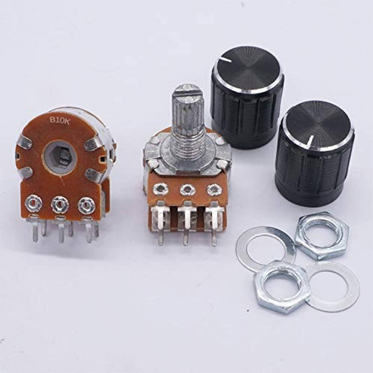 Potentiometer set with black knobs, metal split shafts, 6-pin terminals, and nuts