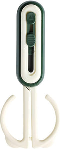 Green-and-white magnetic scissors with U guard and dark blade mechanism.