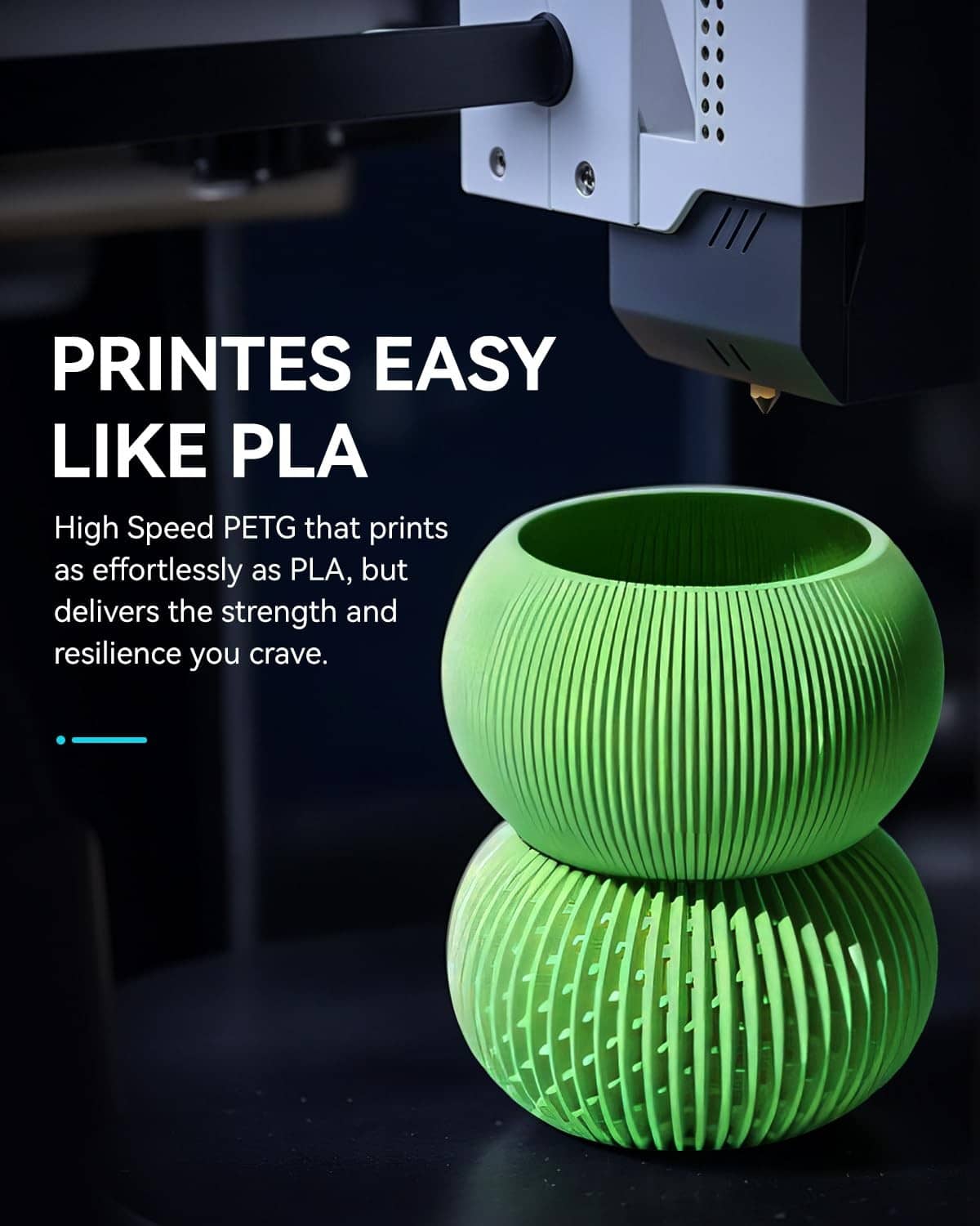 Green PETG filament spool with stacked reel beneath