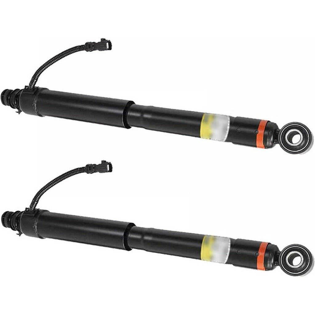 Pair of black shock absorber strut assemblies with yellow safety strip and rod eye mounts