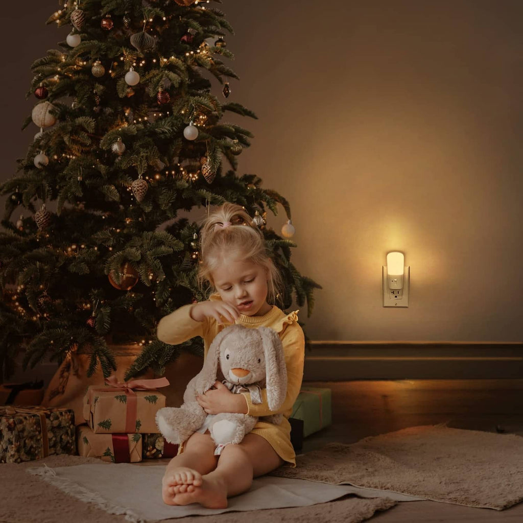 White plug-in LED night light with warm glow for evening illumination