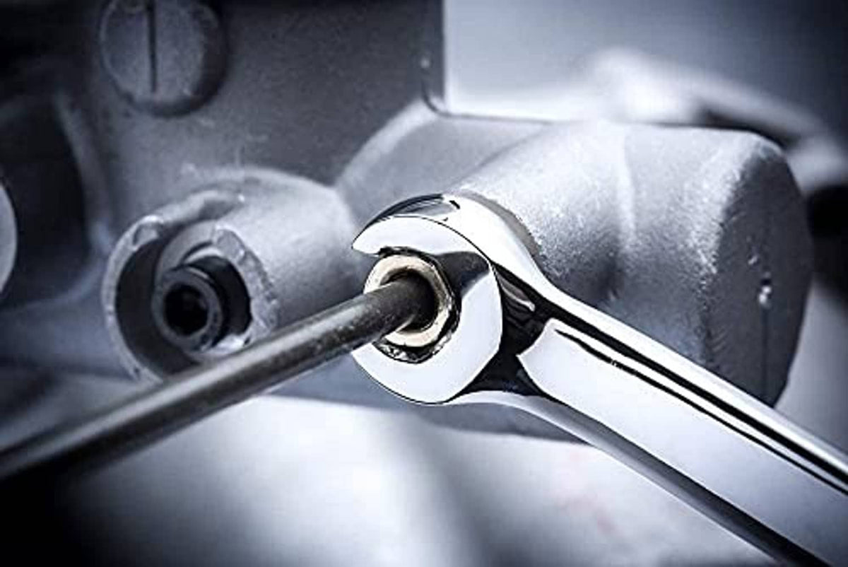 Chrome flare nut wrench close-up gripping a fitting