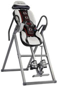 Heat and massage inversion table with padded headrest and black cushioned backrest