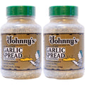 Pair of garlic spread seasoning bottles with green caps and tan speckled contents