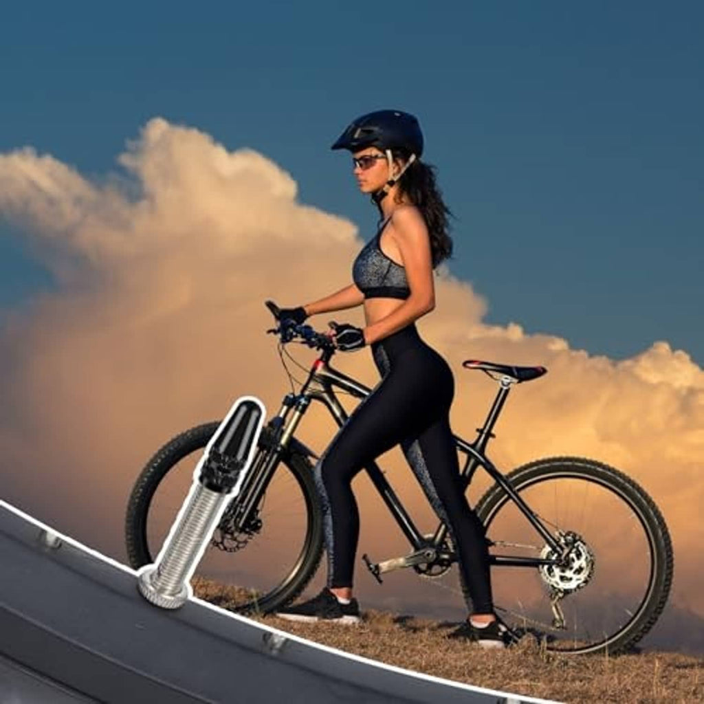 Silver aluminum Presta valve cap with knurled band on bicycle wheel valve area