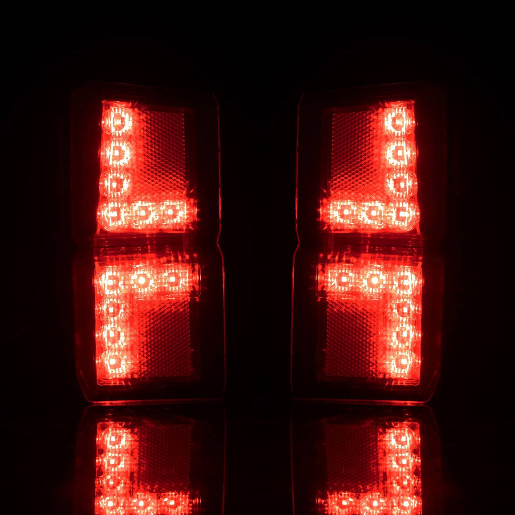 Bright red LED rear tail lights with stacked vertical lens blocks, illuminated