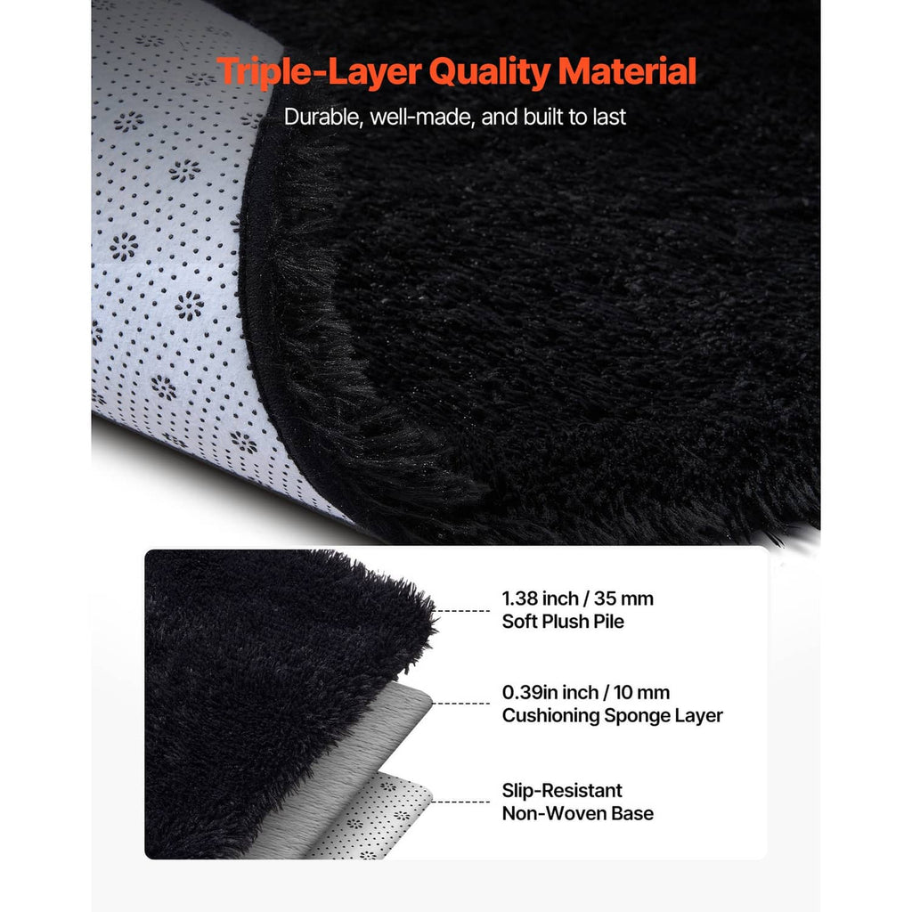 Close-up of black plush area rug edge with layered construction and soft pile