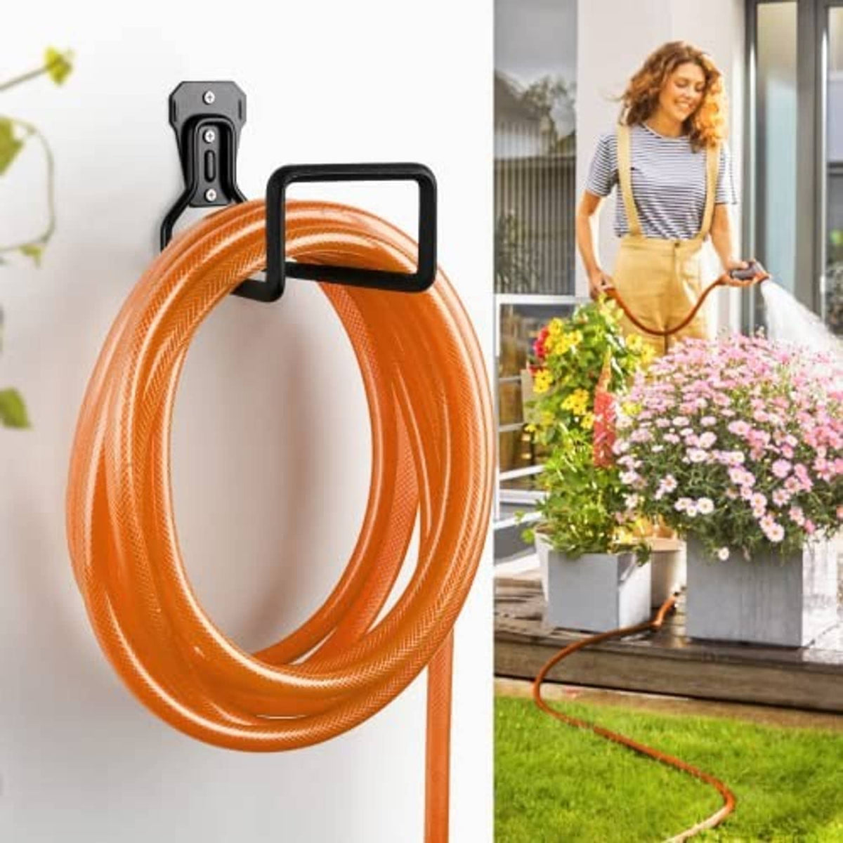 Wall-mounted black hose holder securing an orange hose loop