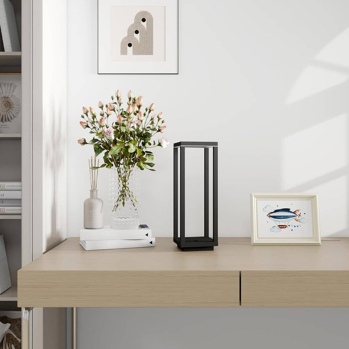 Black lantern table lamp with warm LED glow on a shelf, cordless compact design