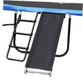 Trampoline slide ladder with black steps and dark slide panel on metal frame