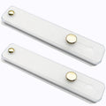 Two white universal phone finger strap holders with gold button mounts