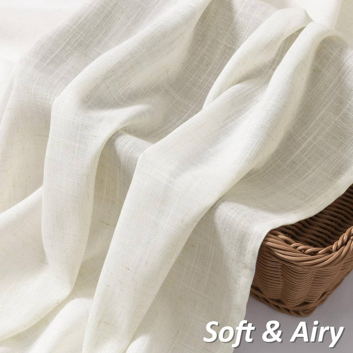 Natural linen curtains with soft, airy folds and draped fabric close-up