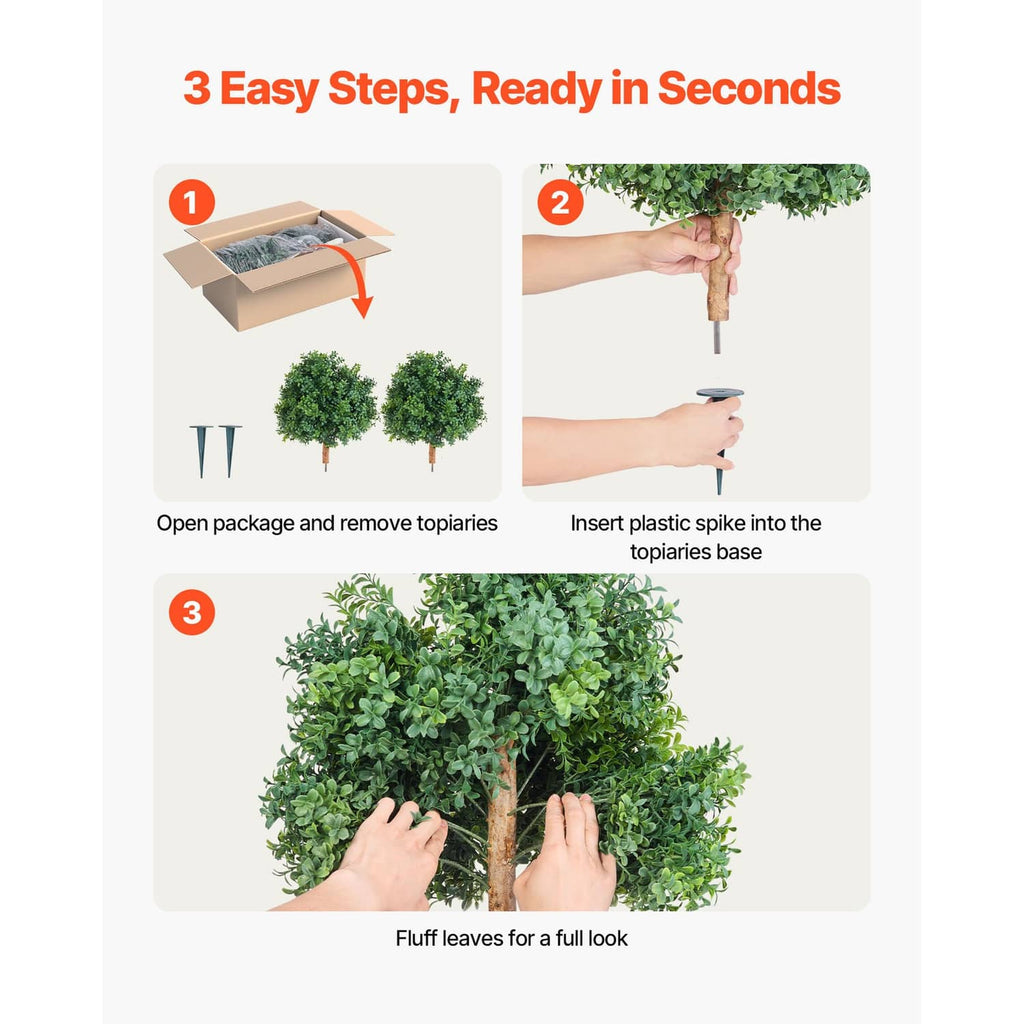 Artificial topiary trees with green foliage and plastic ground spikes for bases