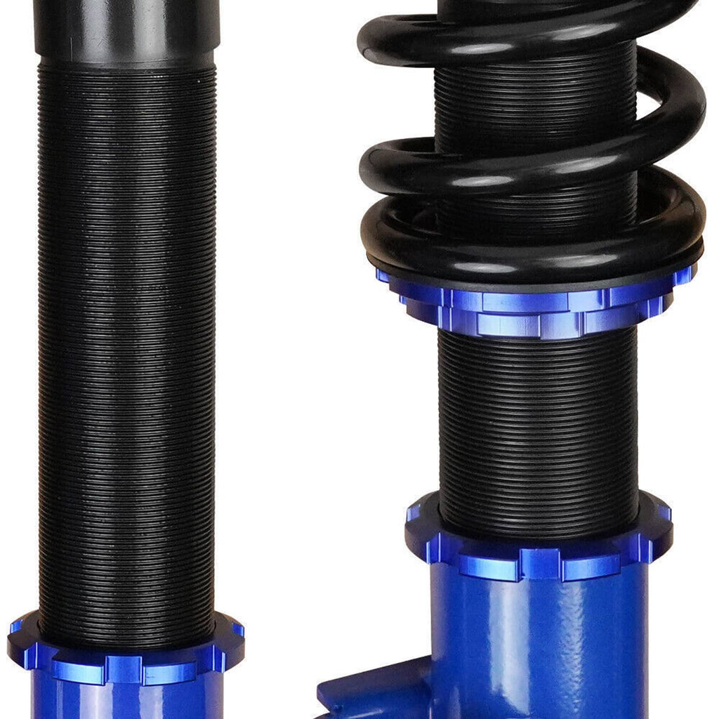 Black spring sleeve and blue adjustment collar on a coilover shock strut