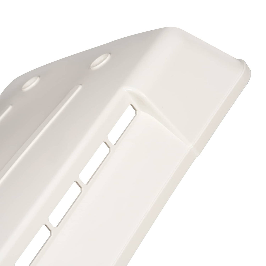 White refrigerator vent cover grille detail with rectangular air slots
