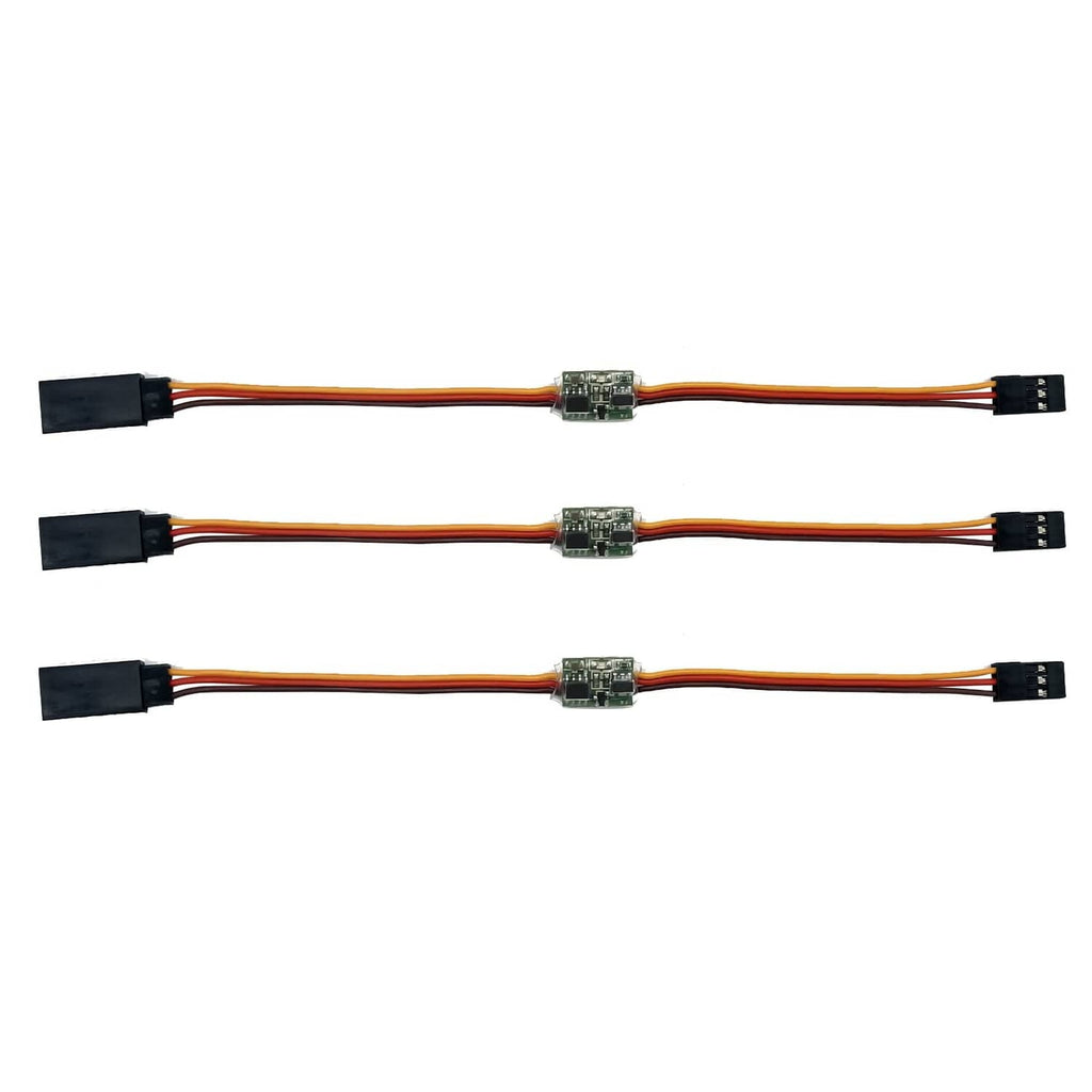 Three RC servo signal reverser boards on long cable leads with plug connectors