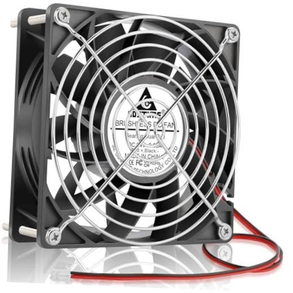 Black 140mm computer fan with metal grille and spinning blades, red and black leads