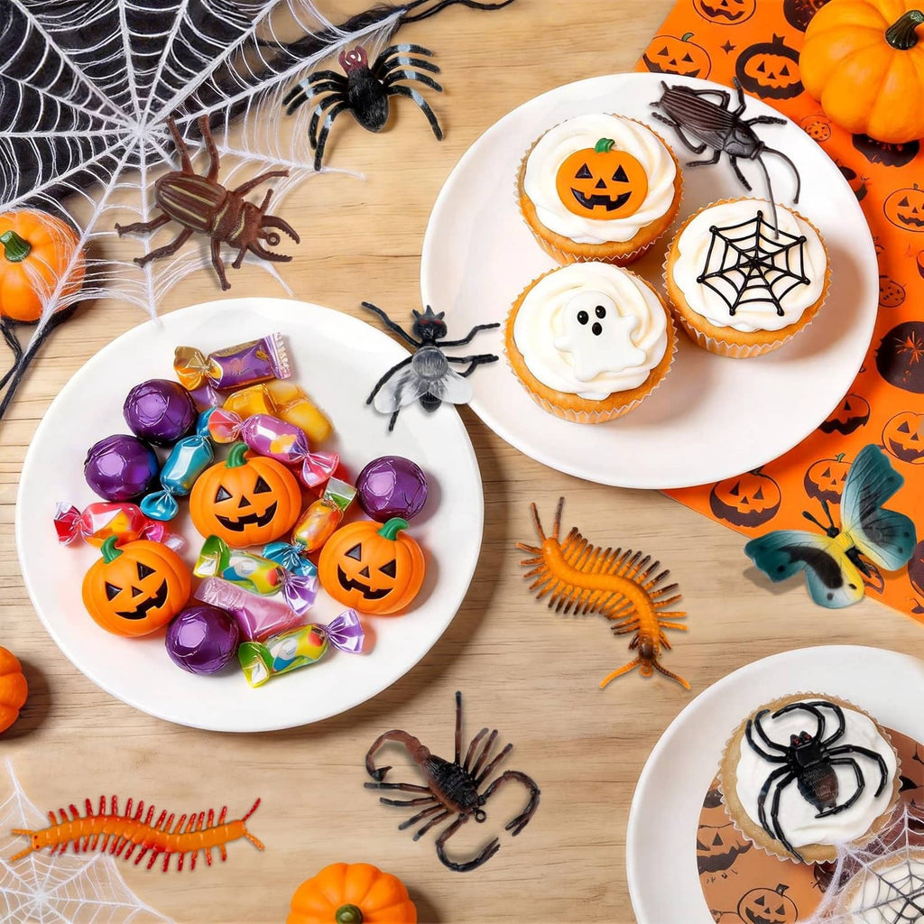 Halloween-themed spread of plastic bug toys and small spider figures
