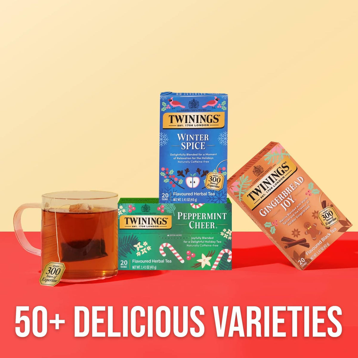 Twinings Peppermint Cheer herbal tea boxes with glass cup of tea