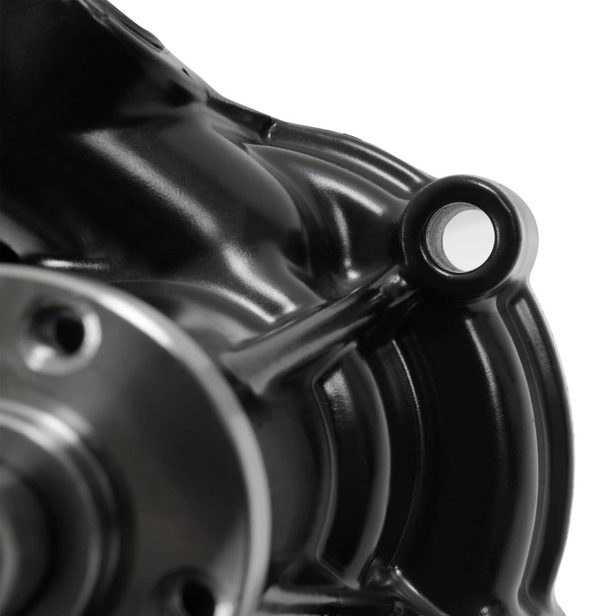Water pump close-up of black casing and metal inlet opening, partial view