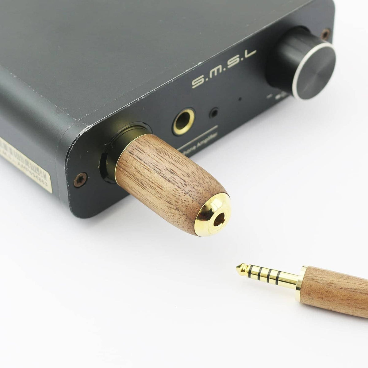 Walnut wood 4.4mm balanced female XLR adapter plug attached to a device port