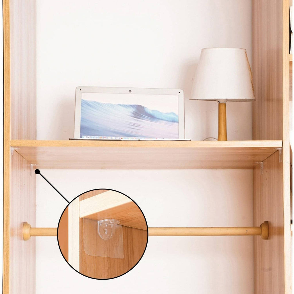 Close-up of clear adhesive shelf support peg under a wooden shelf