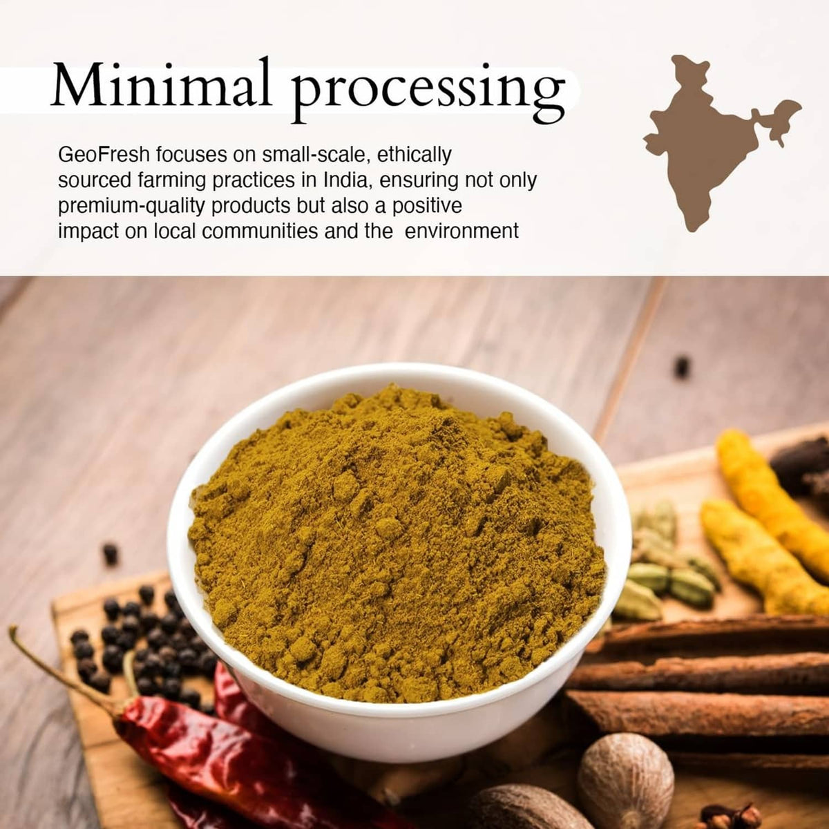 Mound of golden curry powder in a white bowl with scattered spices and seeds