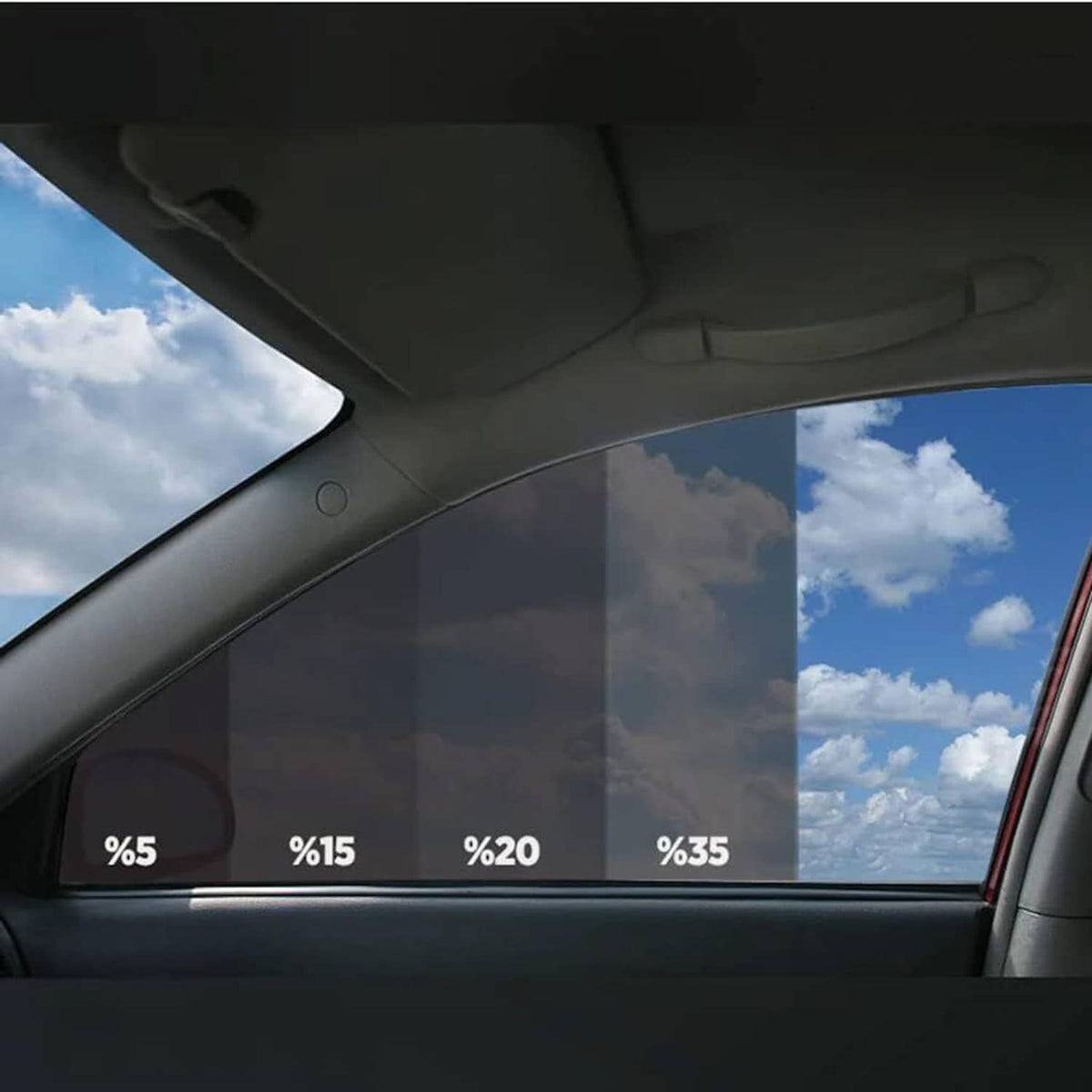 Dark window tint film applied on car rear side window, outside view visible